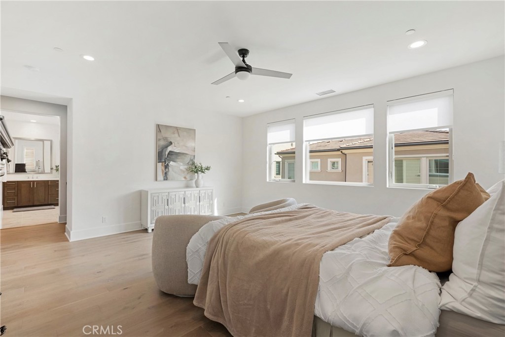 84 Rockinghorse Irvine, CA 92602 - Photo 43 of 63 a bedroom with a bed and a large window