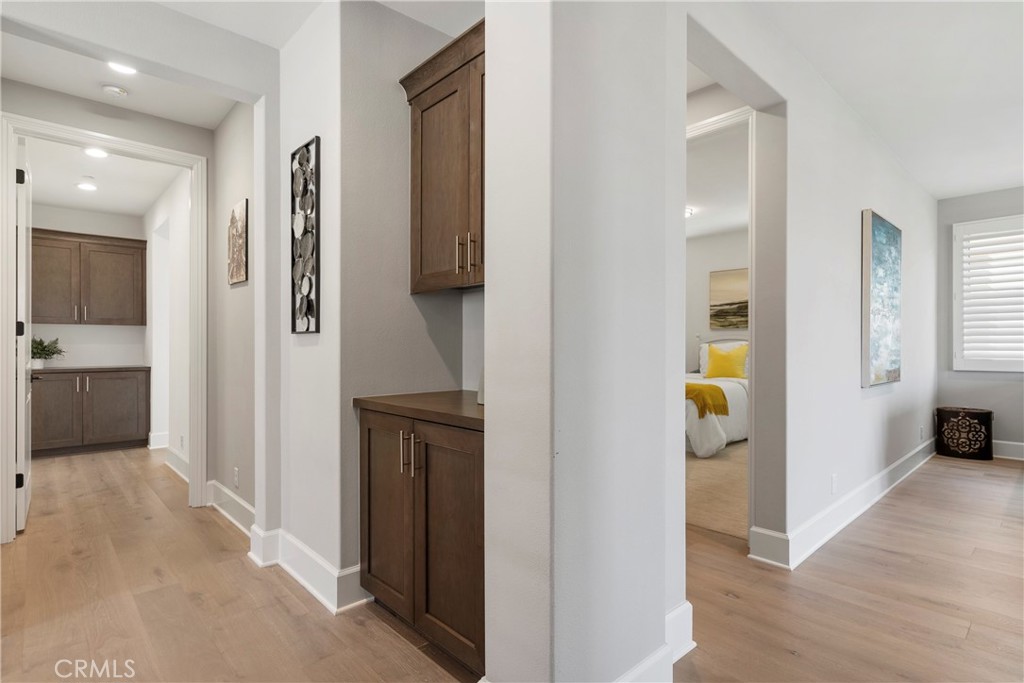 84 Rockinghorse Irvine, CA 92602 - Photo 45 of 63 a view of a hallway with bathroom and wooden floor
