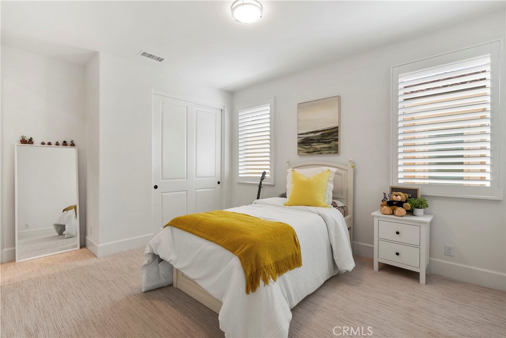 84 Rockinghorse Irvine, CA 92602 - Photo 47 of 63 a bedroom with a bed and a closet
