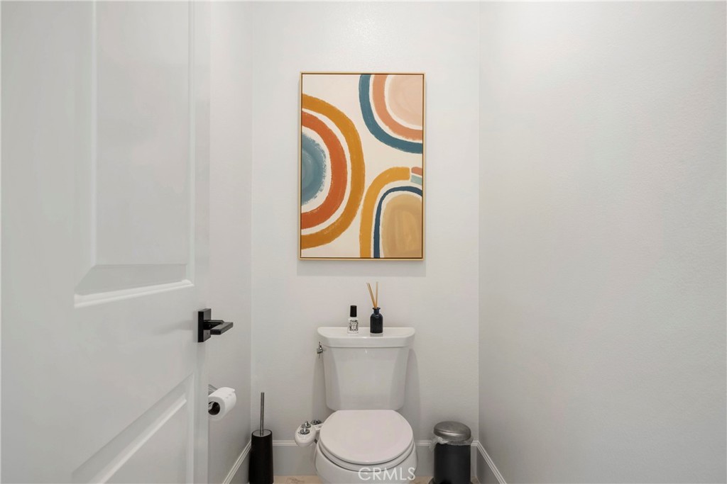 84 Rockinghorse Irvine, CA 92602 - Photo 49 of 63 a bathroom with a toilet sink and mirror