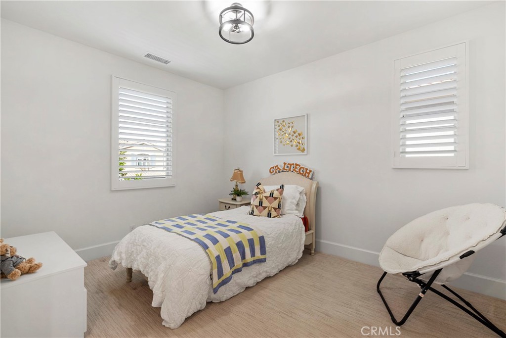 84 Rockinghorse Irvine, CA 92602 - Photo 51 of 63 a bedroom with a bed and a window