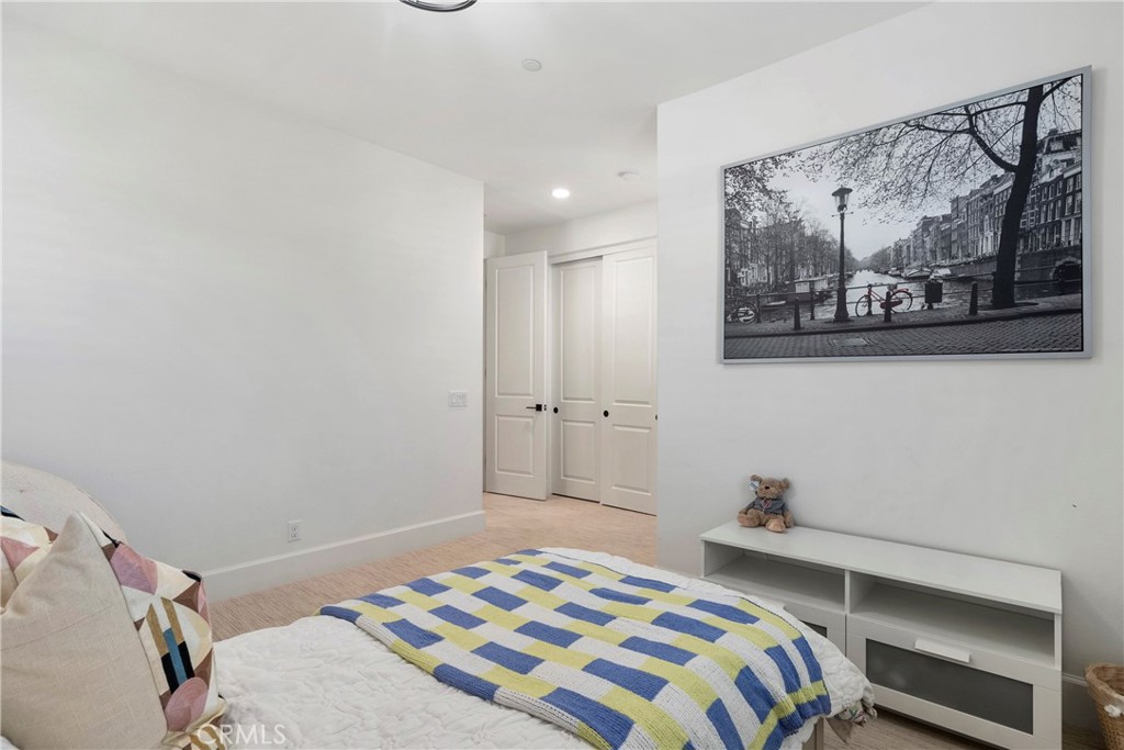 84 Rockinghorse Irvine, CA 92602 - Photo 52 of 63 a bedroom with a bed and a wall painting