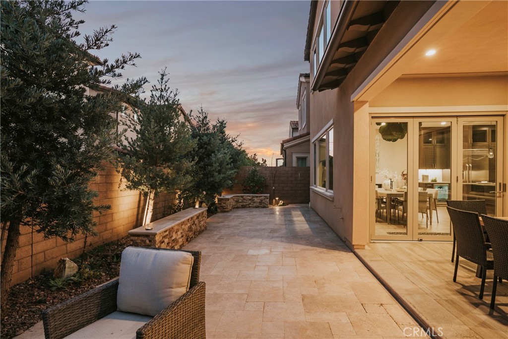 84 Rockinghorse Irvine, CA 92602 - Photo 54 of 63 a view of a patio with table and chairs and potted plants