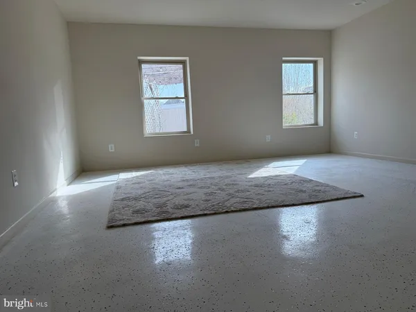 an empty room with windows