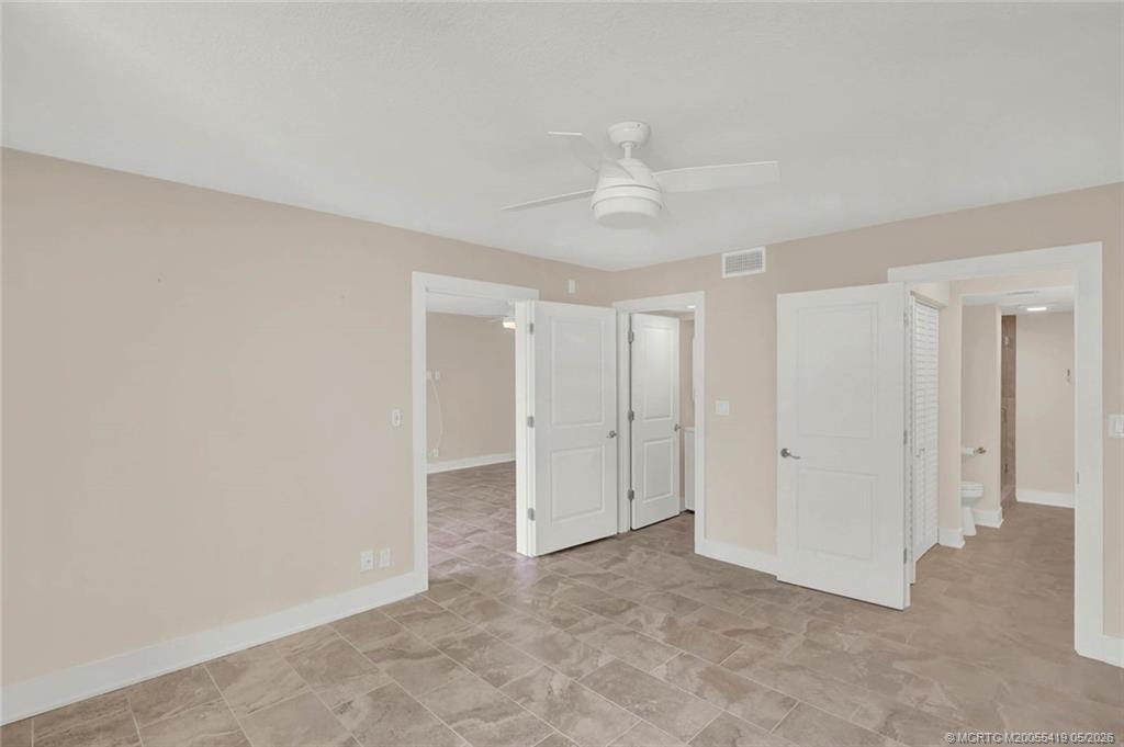 1950 Southwest Palm City Road, Unit 14305 Stuart, FL 34994 - Photo 35 of 70 an empty room with a ceiling fan and a window