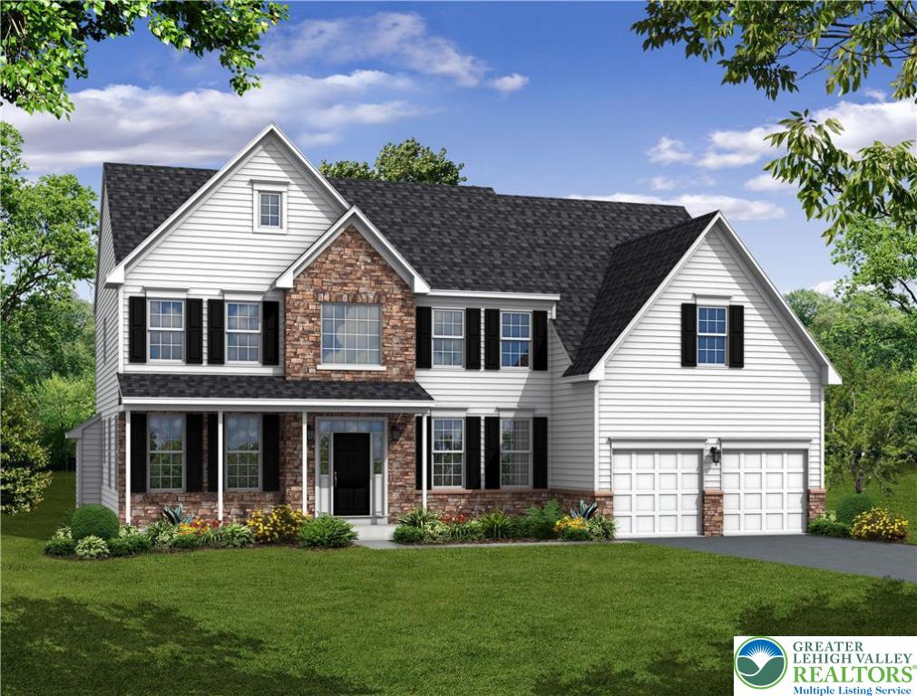 a front view of a house with a garden and trees