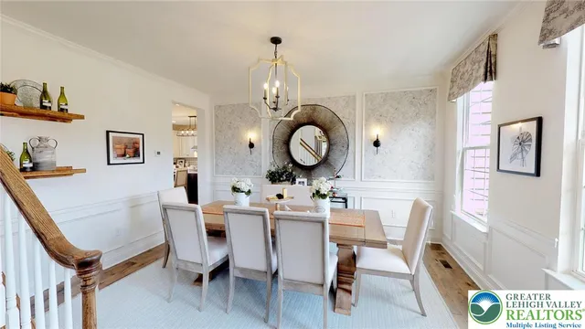 a living room with furniture fireplace and a large window