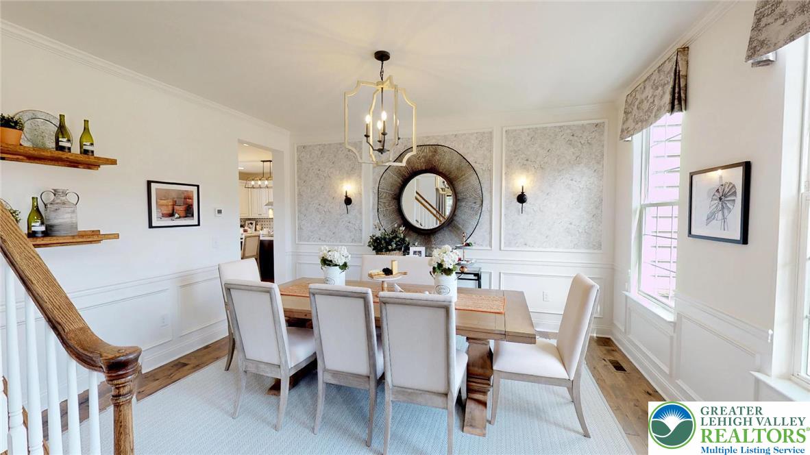 5137 Schantz Road, Unit THE ROOSEVELT Allentown, PA 18104 - Photo 14 of 39 a view of a dining room with furniture and chandelier