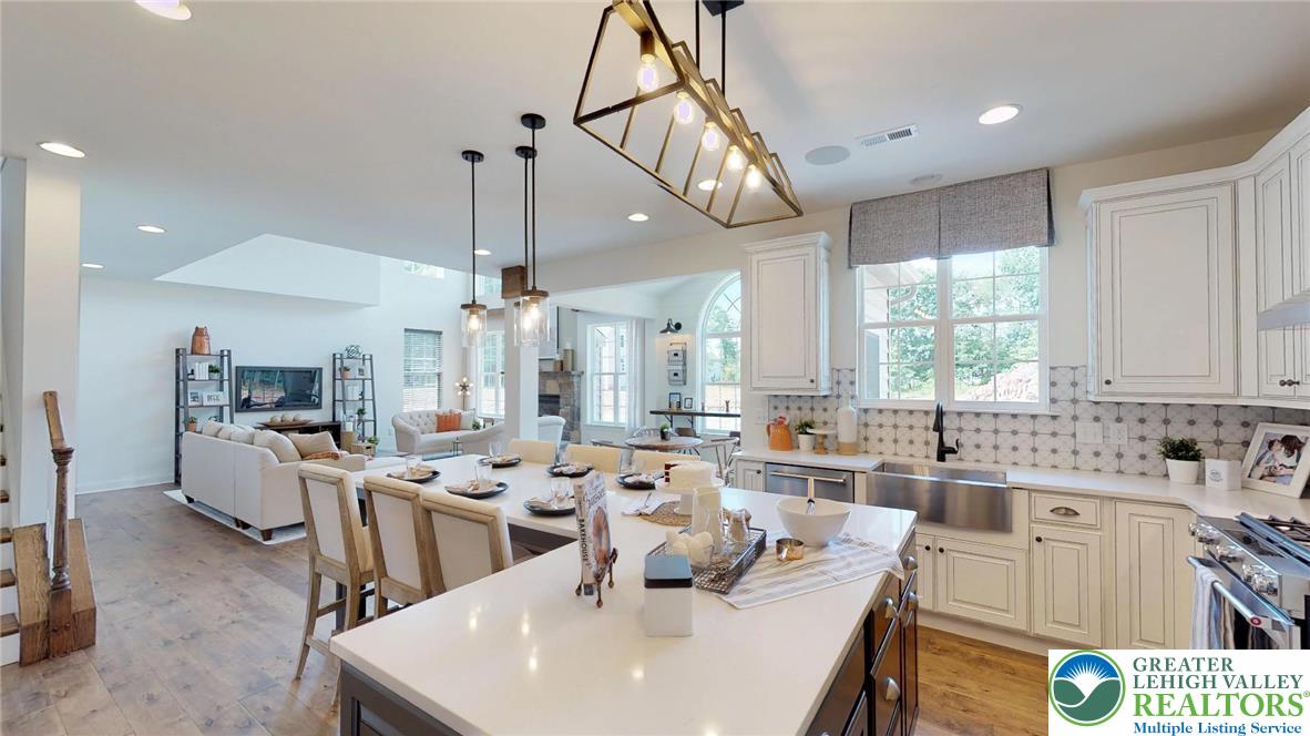 5137 Schantz Road, Unit THE ROOSEVELT Allentown, PA 18104 - Photo 25 of 39 a large kitchen with a large window and stainless steel appliances