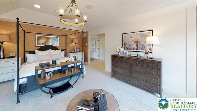 a bedroom with furniture and a window