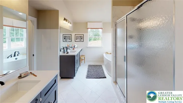 a living room with furniture a large window and wooden floor