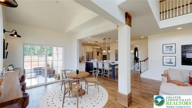 a dining room with furniture and window