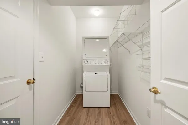 a view of an entryway with wooden floor