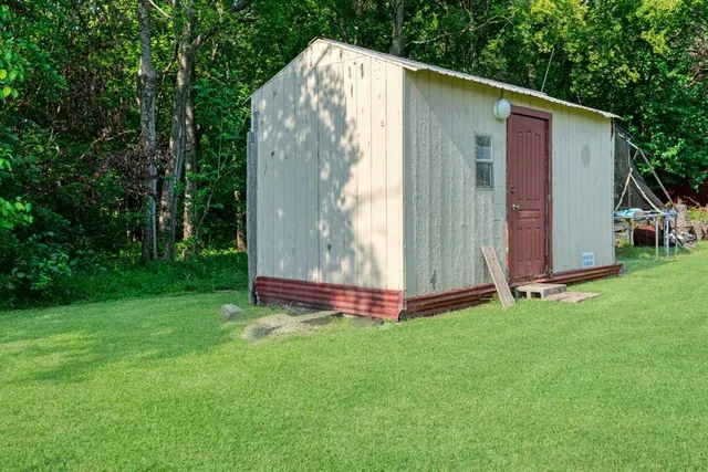 a backyard of a house with lots of green space
