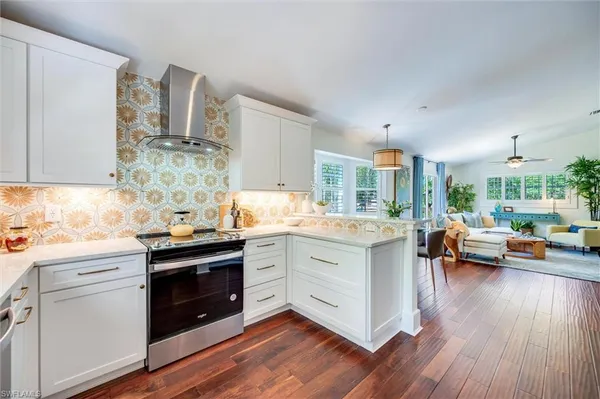 a kitchen with sink cabinets and wooden floor