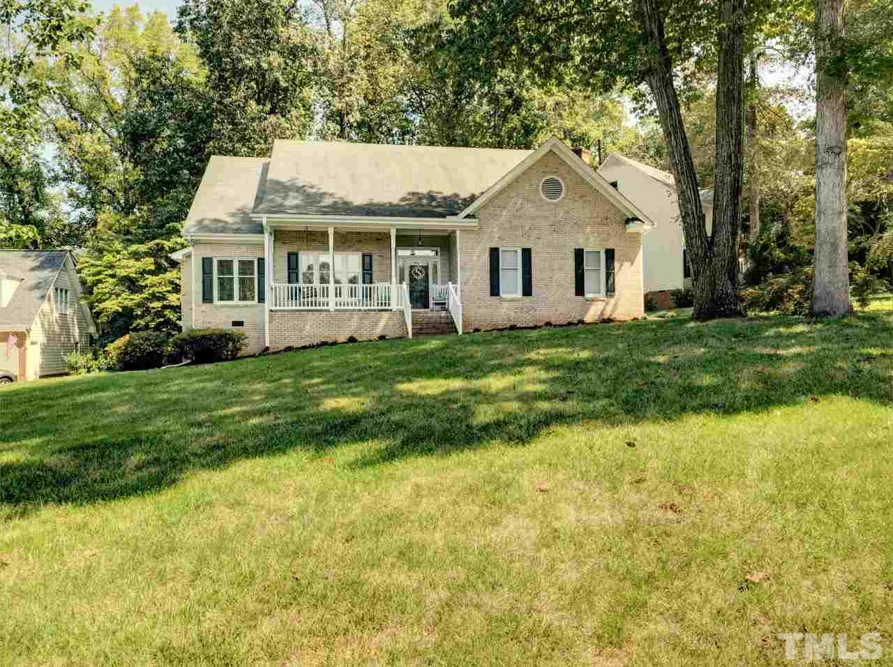 7901 Sandy Bottom Way Raleigh, NC 27613 - Photo 1 of 28 a view of house with a big yard and large trees