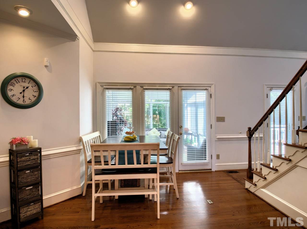 7901 Sandy Bottom Way Raleigh, NC 27613 - Photo 10 of 28 a view of a dining room with furniture window and wooden floor
