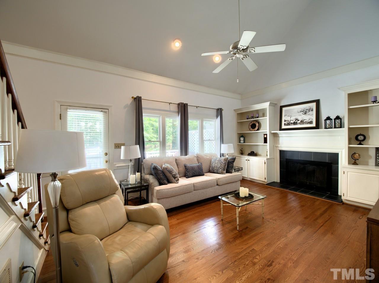 7901 Sandy Bottom Way Raleigh, NC 27613 - Photo 16 of 28 a living room with furniture and a fireplace