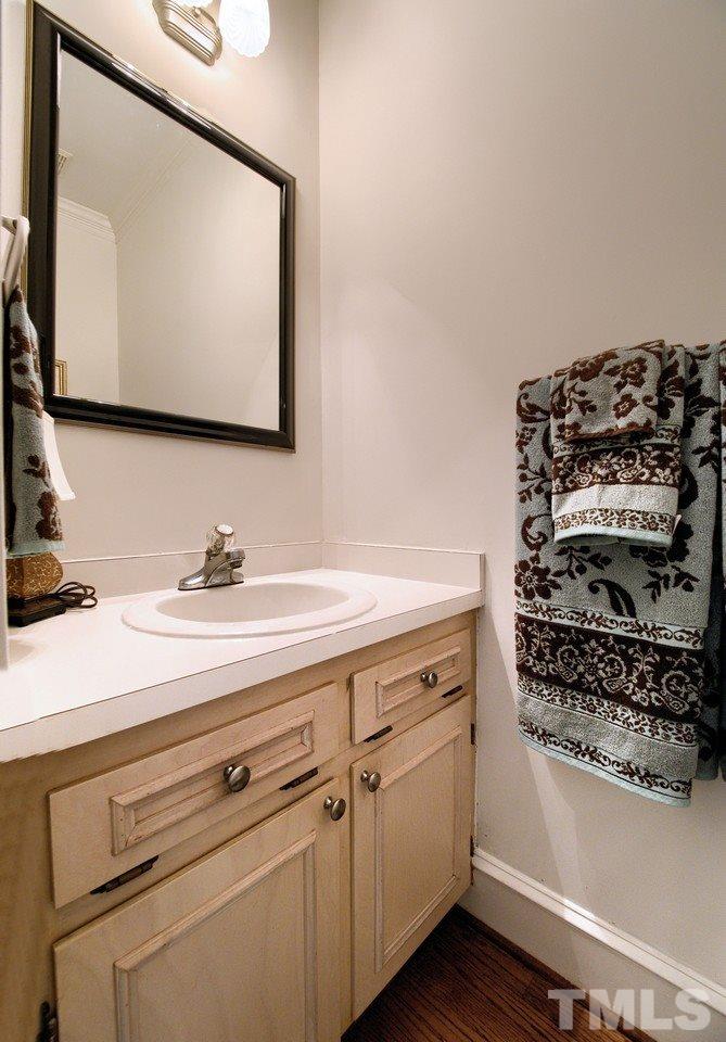 7901 Sandy Bottom Way Raleigh, NC 27613 - Photo 18 of 28 a bathroom with a sink and a mirror