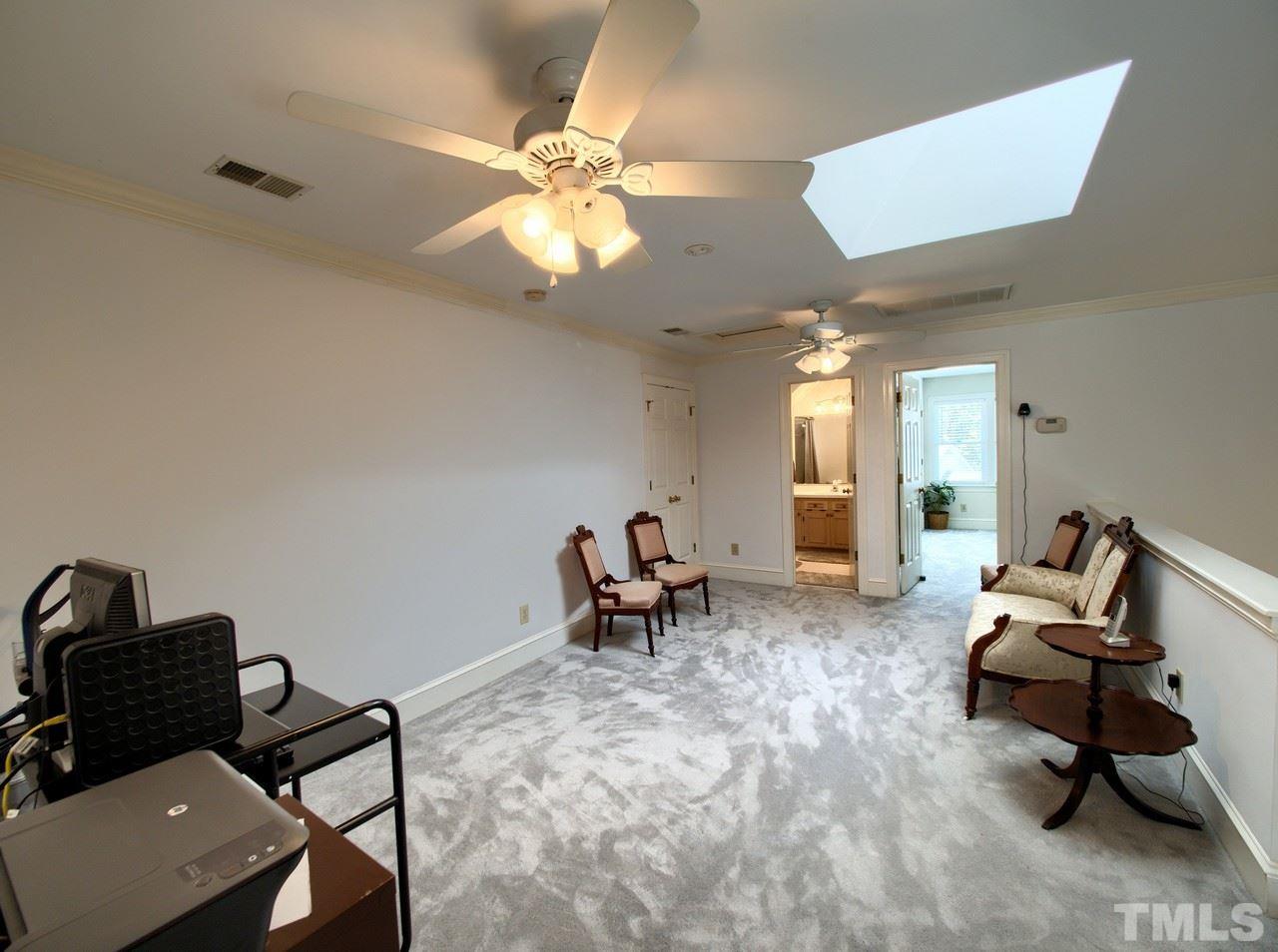 7901 Sandy Bottom Way Raleigh, NC 27613 - Photo 20 of 28 a living room with furniture and a window