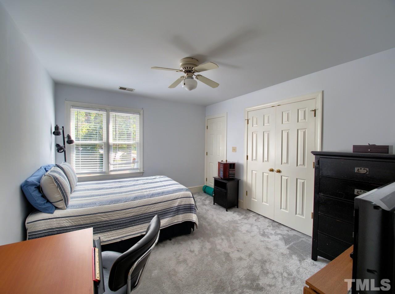 7901 Sandy Bottom Way Raleigh, NC 27613 - Photo 21 of 28 a bedroom with furniture and a window
