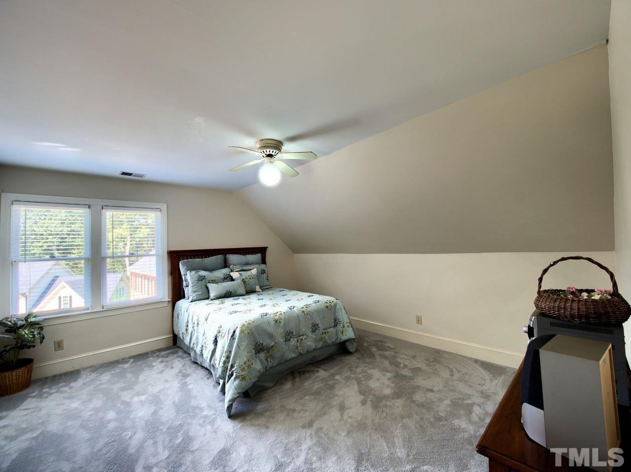 7901 Sandy Bottom Way Raleigh, NC 27613 - Photo 23 of 28 a room with a bed and a window