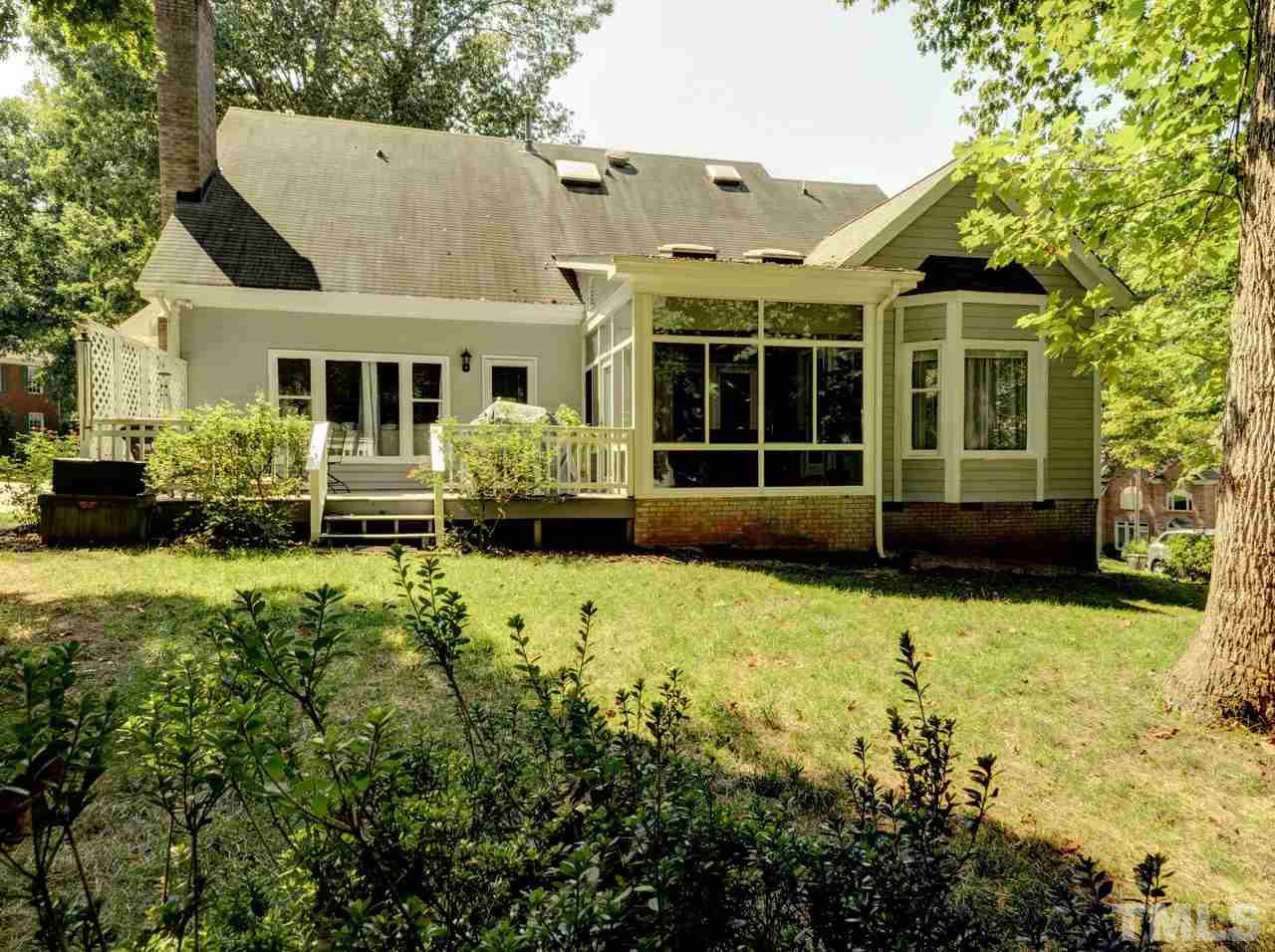 7901 Sandy Bottom Way Raleigh, NC 27613 - Photo 26 of 28 a front view of a house with a yard and potted plants