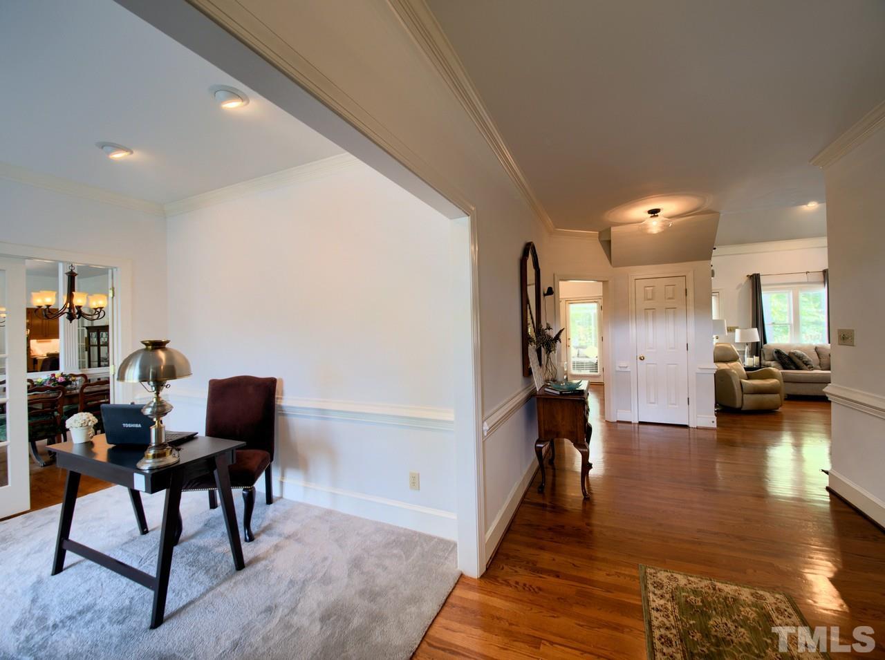 7901 Sandy Bottom Way Raleigh, NC 27613 - Photo 4 of 28 a living room with furniture and a wooden floor
