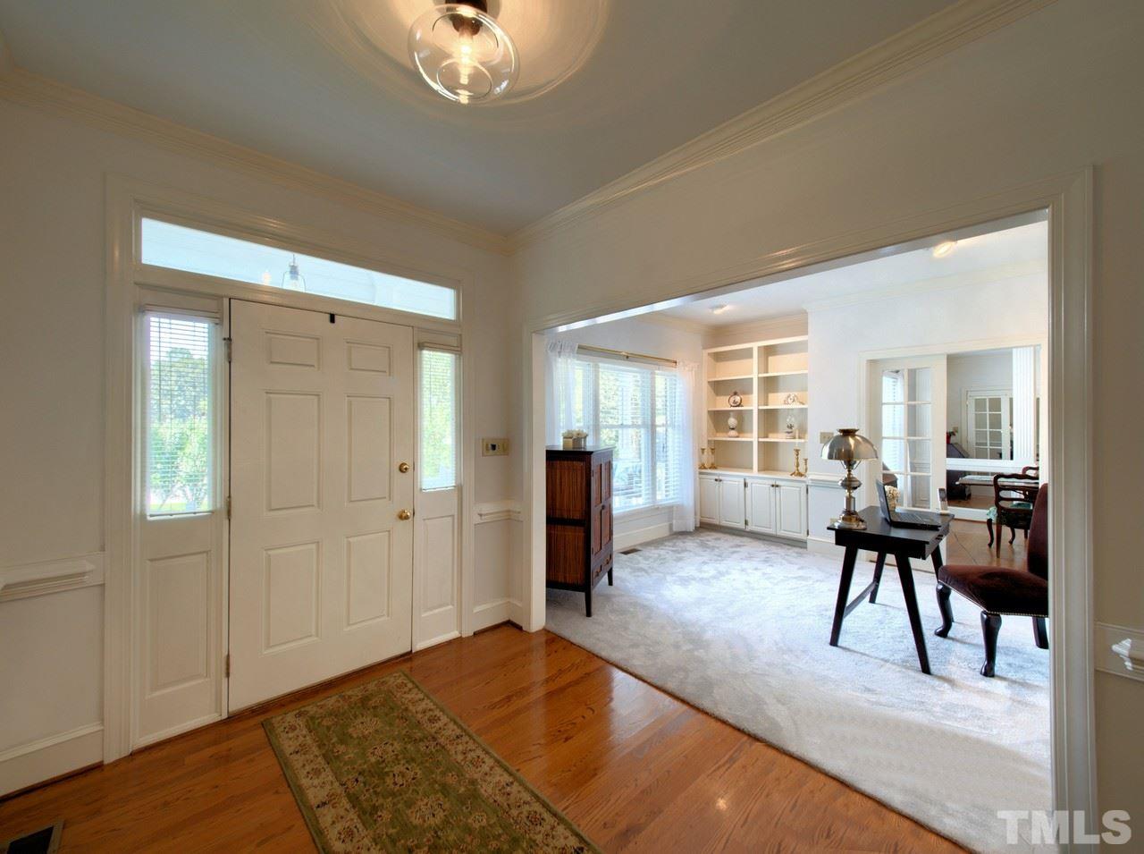 7901 Sandy Bottom Way Raleigh, NC 27613 - Photo 6 of 28 a view of a livingroom with furniture window and wooden floor