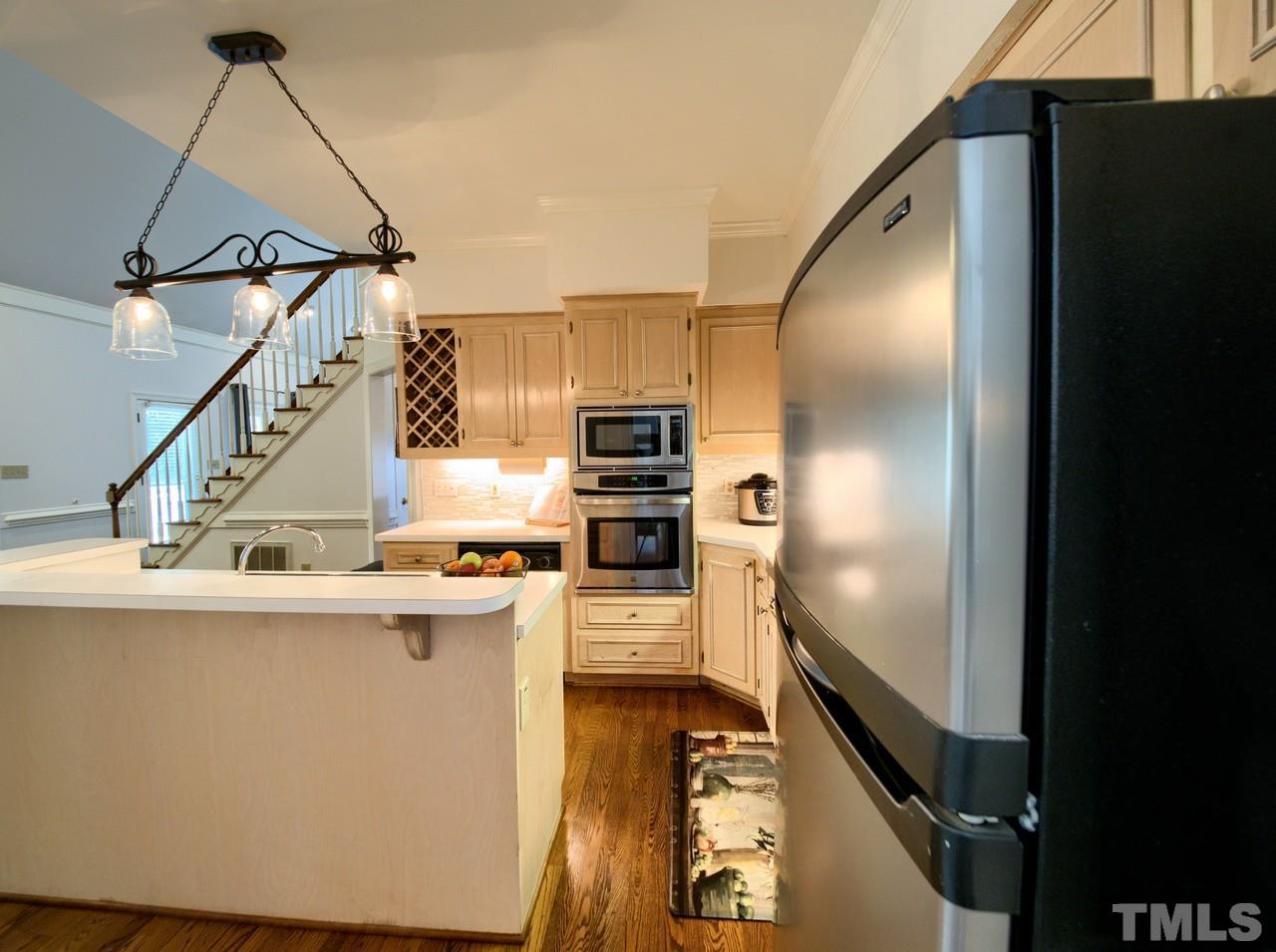 7901 Sandy Bottom Way Raleigh, NC 27613 - Photo 8 of 28 a kitchen with stainless steel appliances granite countertop a refrigerator a stove and a sink