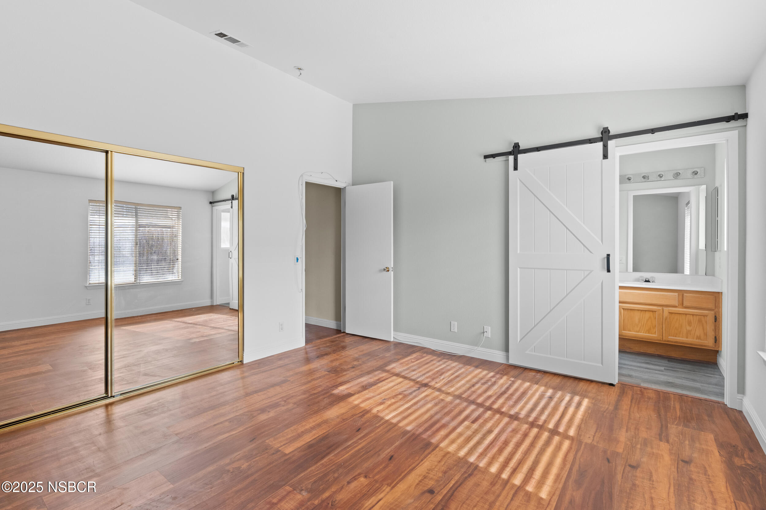 1458 Jacaranda Court Santa Maria, CA 93458 - Photo 14 of 24 a view of empty room with wooden floor and fan
