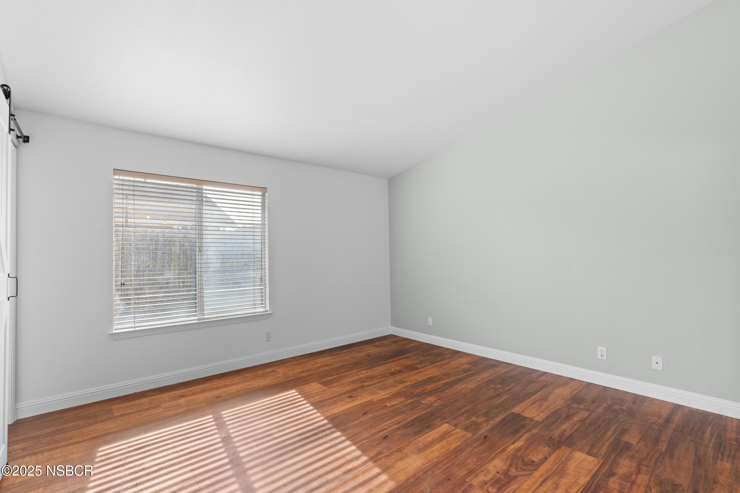 1458 Jacaranda Court Santa Maria, CA 93458 - Photo 16 of 24 an empty room with wooden floor and windows