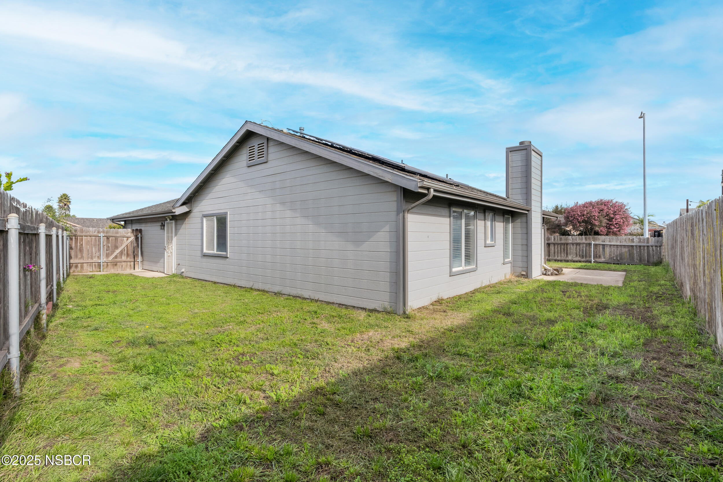1458 Jacaranda Court Santa Maria, CA 93458 - Photo 22 of 24 a view of a house with backyard and garden