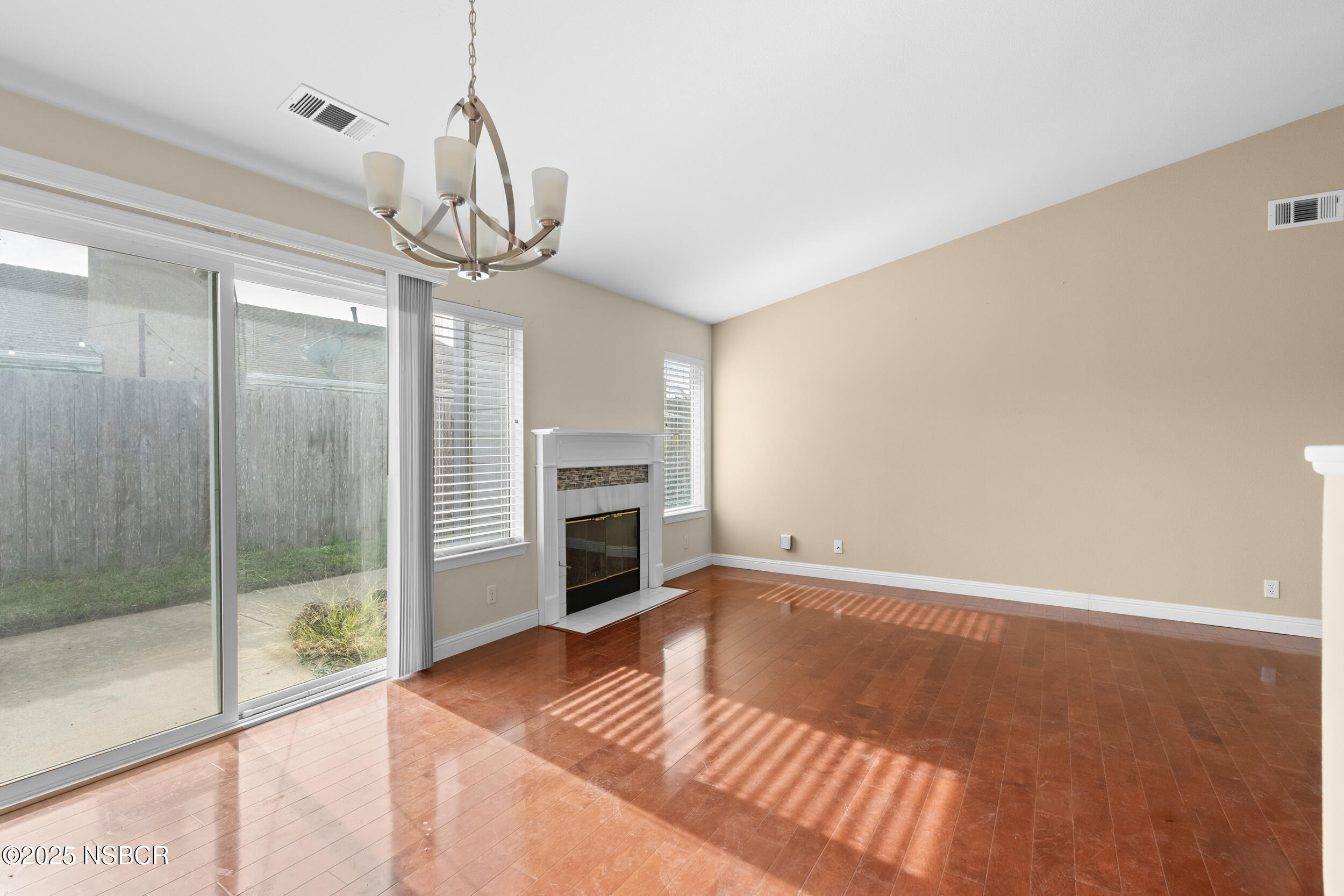 1458 Jacaranda Court Santa Maria, CA 93458 - Photo 8 of 24 a view of an empty room with a fireplace