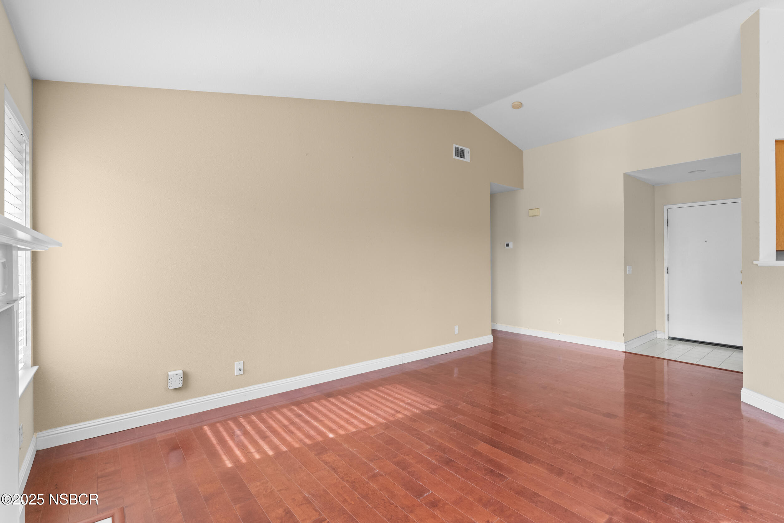 1458 Jacaranda Court Santa Maria, CA 93458 - Photo 9 of 24 a view of an empty room with wooden floor