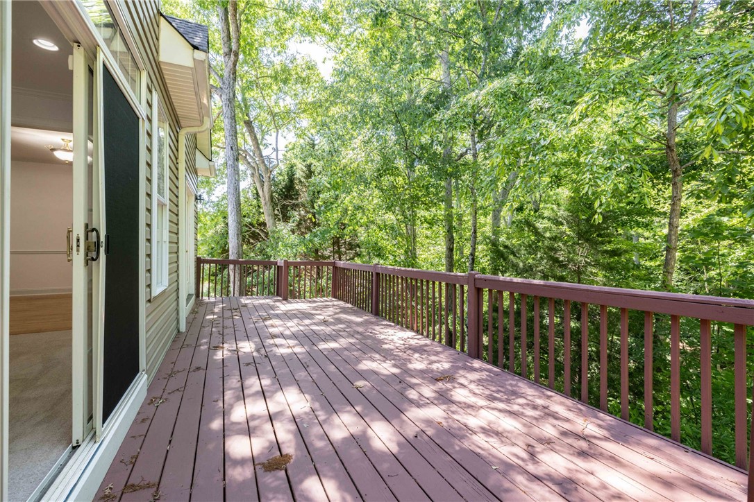 110 Brookstone Way Central, SC 29630 - Photo 17 of 46 This spacious wooden deck offers serene views of the surrounding trees.