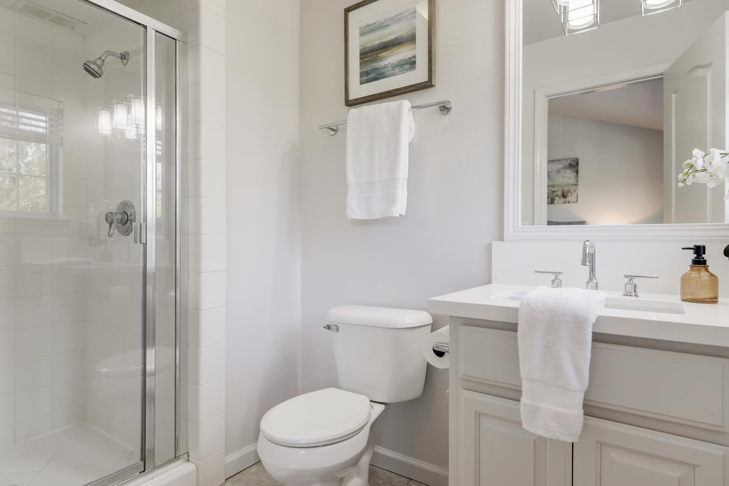 20 Willow Road, Unit 26 Menlo Park, CA 94025 - Photo 14 of 20 a bathroom with a toilet sink a shower and mirror