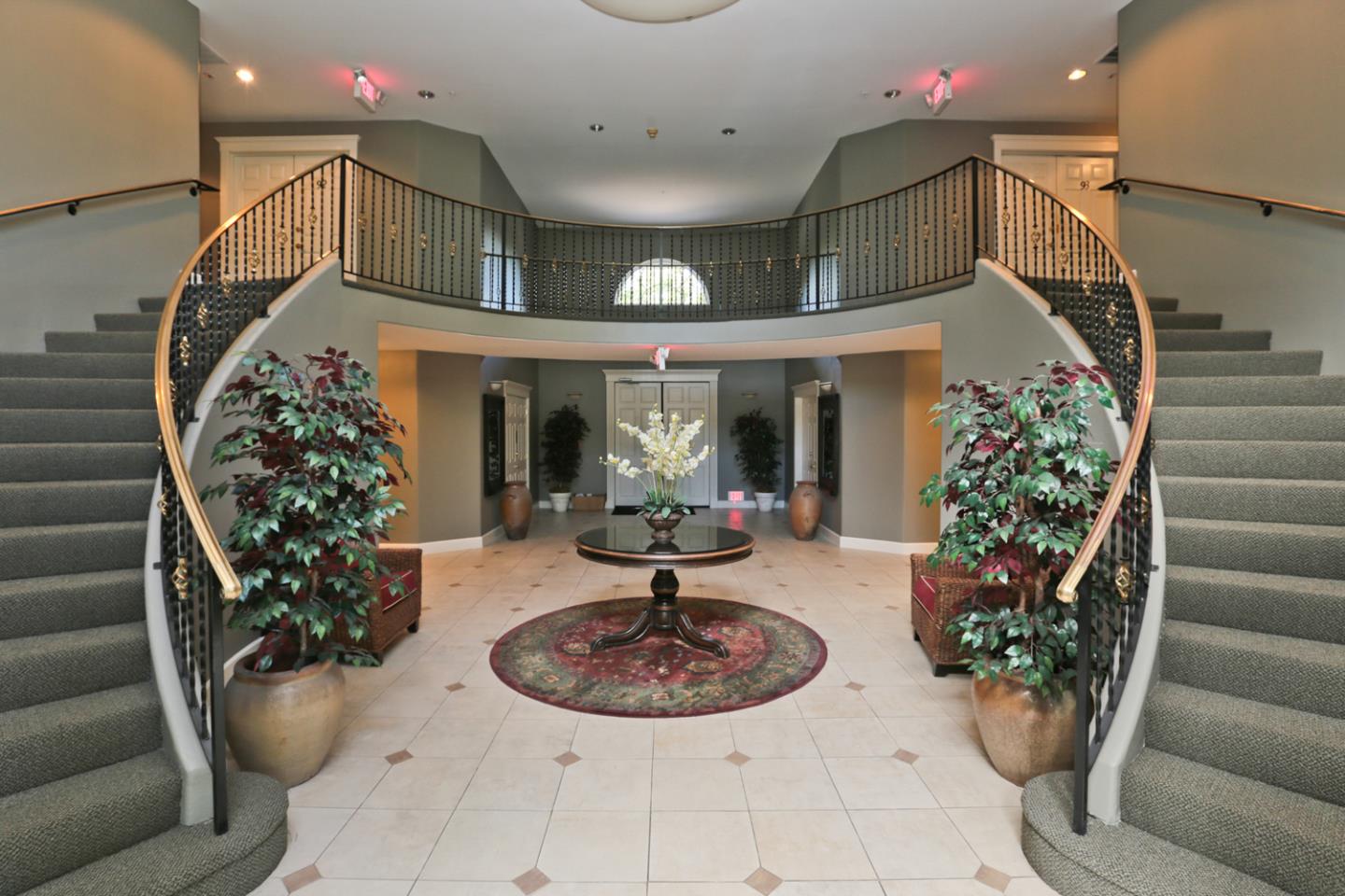 20 Willow Road, Unit 26 Menlo Park, CA 94025 - Photo 18 of 20 a view of a porch with a potted plant and floor to ceiling window