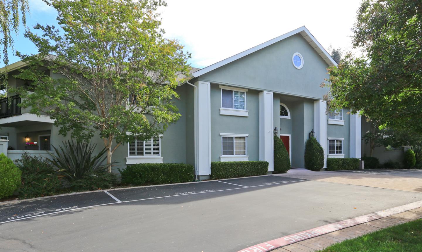 20 Willow Road, Unit 26 Menlo Park, CA 94025 - Photo 19 of 20 a front view of a house with a yard and garage