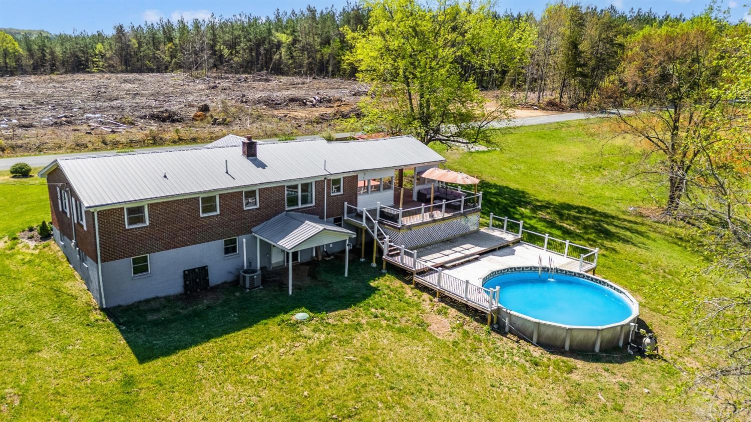 2477 Mountain Road Java, VA 24565 - Photo 27 of 33 an aerial view of a house with swimming pool garden and patio