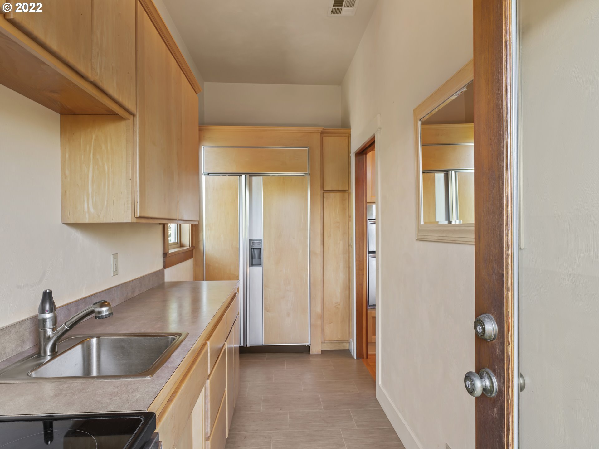 30923 Fox Hollow Road Eugene, OR 97405 - Photo 16 of 31 a kitchen with stainless steel appliances granite countertop a sink and a refrigerator