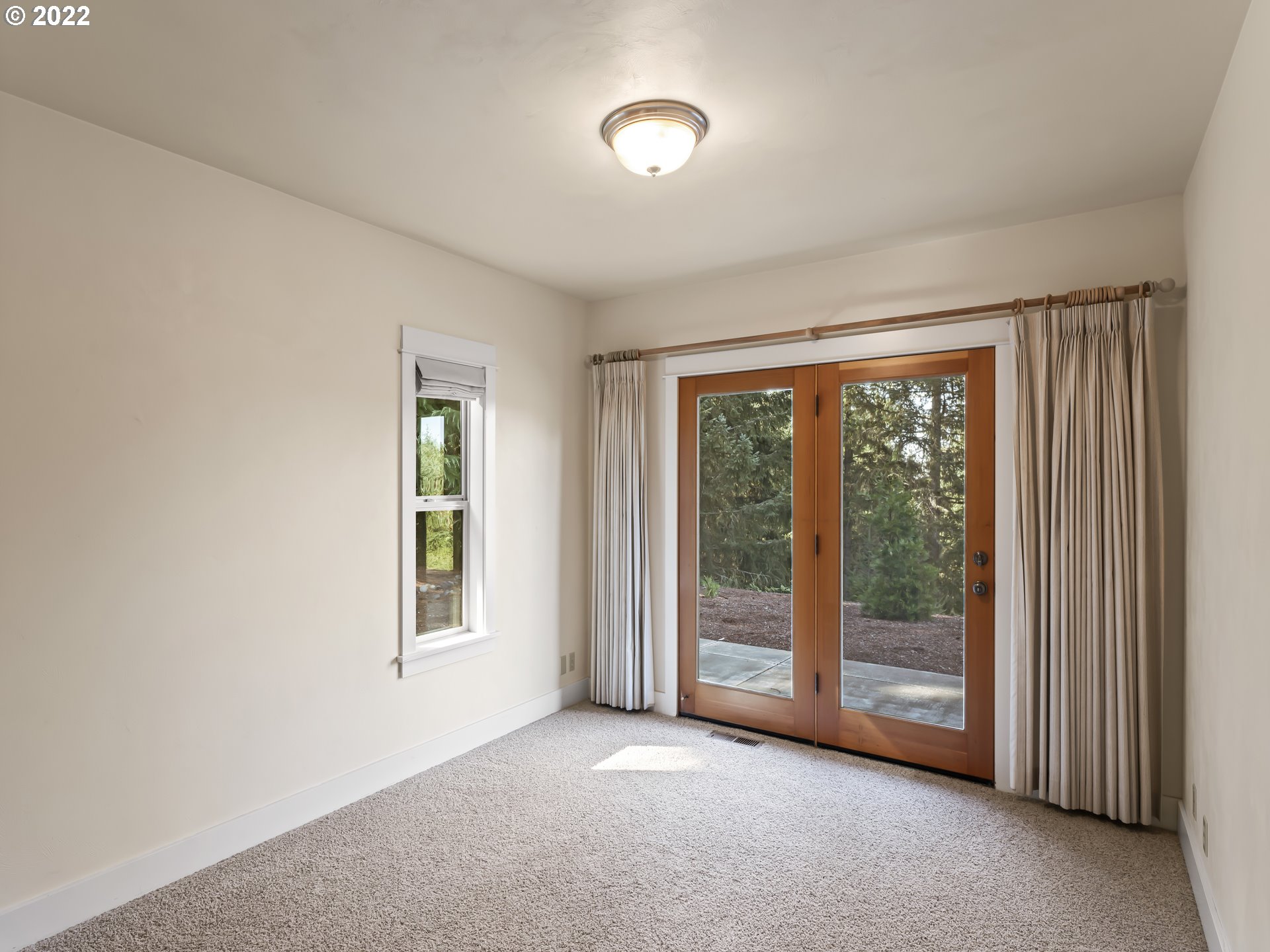 30923 Fox Hollow Road Eugene, OR 97405 - Photo 21 of 31 wooden floor and windows in an empty room