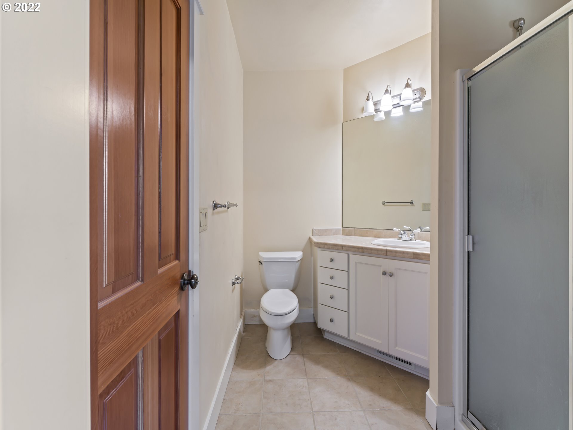 30923 Fox Hollow Road Eugene, OR 97405 - Photo 24 of 31 a bathroom with a granite countertop toilet and a sink