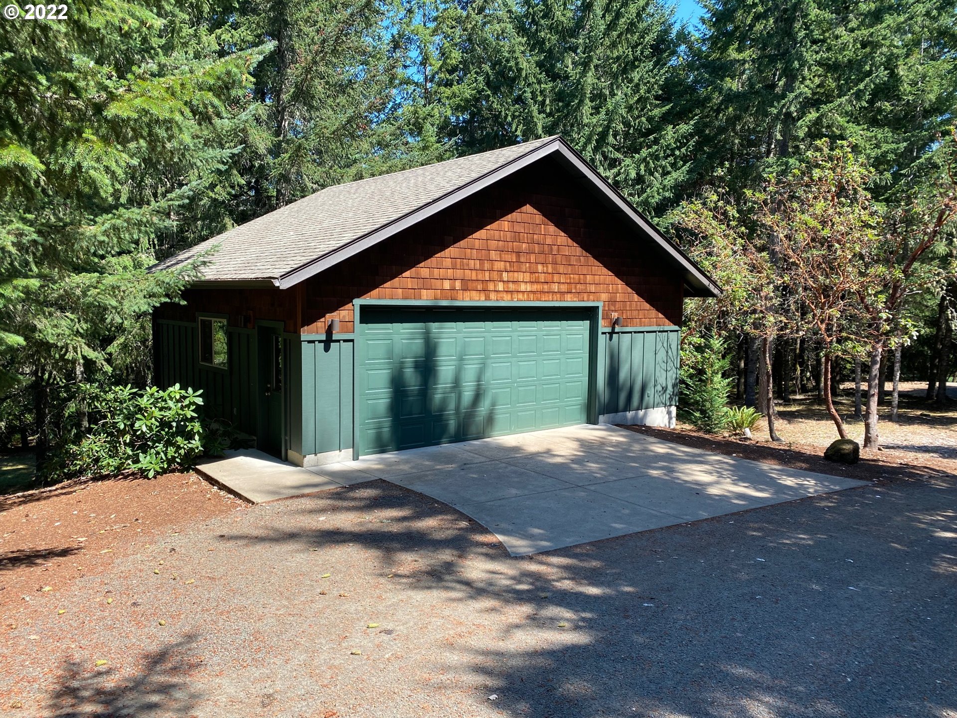30923 Fox Hollow Road Eugene, OR 97405 - Photo 30 of 31 a front view of a house with a garden