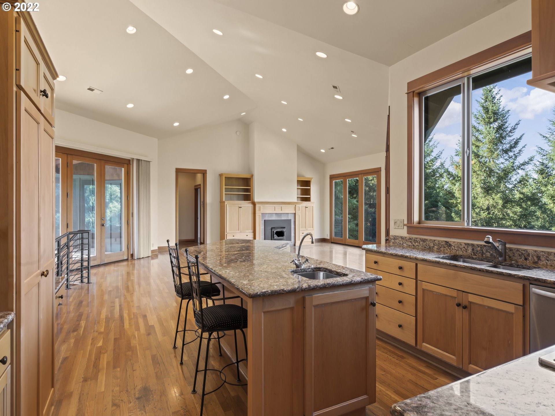 30923 Fox Hollow Road Eugene, OR 97405 - Photo 8 of 31 a kitchen with a table chairs sink and cabinets