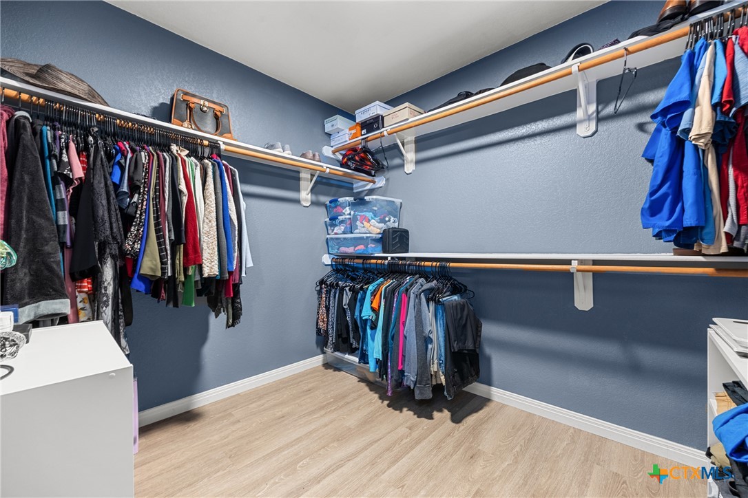 3410 Regency Court Killeen, TX 76549 - Photo 12 of 27 a view of walk in closet with clothes and shoes