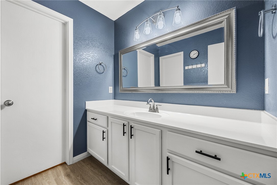 3410 Regency Court Killeen, TX 76549 - Photo 14 of 27 a bathroom with a sink and a mirror