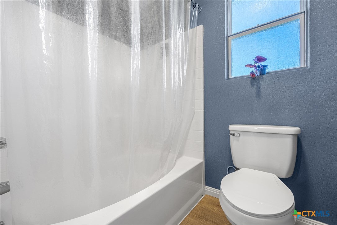 3410 Regency Court Killeen, TX 76549 - Photo 15 of 27 a white toilet sitting next to a shower