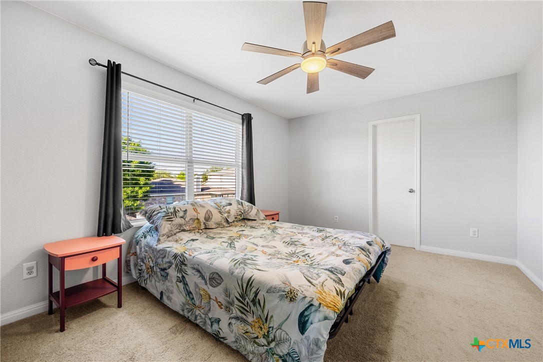 3410 Regency Court Killeen, TX 76549 - Photo 25 of 27 a bedroom with a bed a table and chair