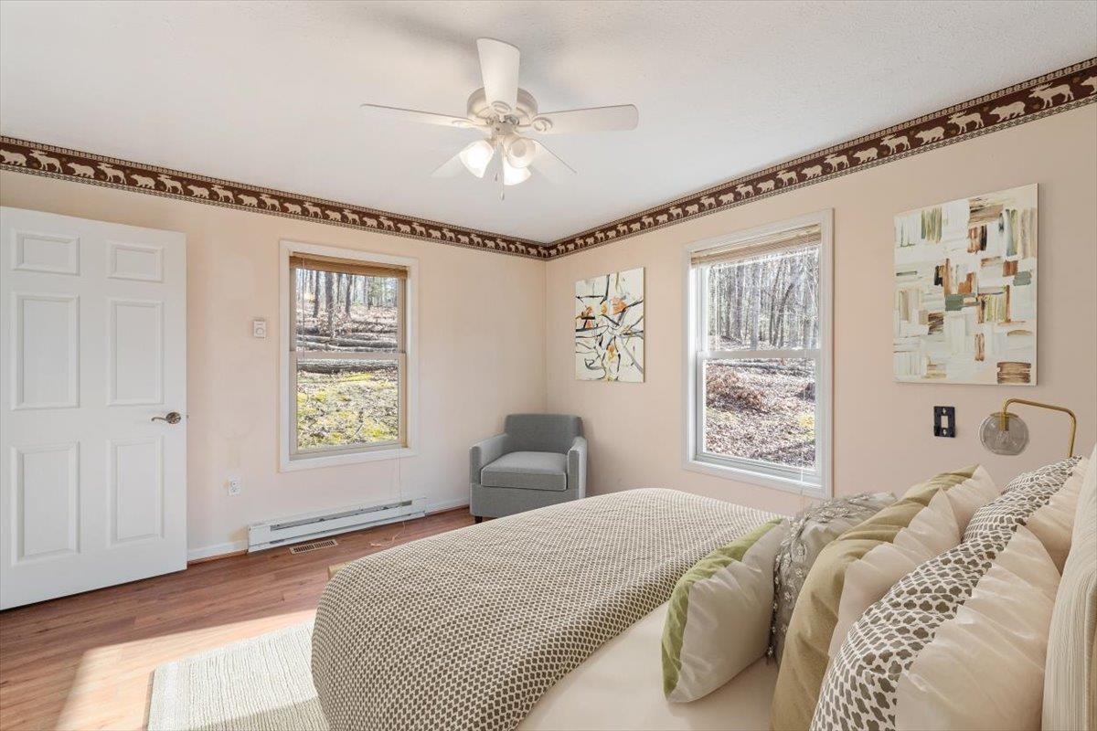 1182 Mullins Road Rio, WV 26755 - Photo 19 of 37 a bedroom with a large bed and a window